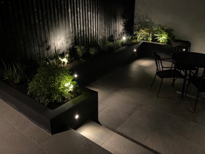 garden spot lights set into black timber raised beds