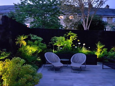 outdoor seating area with cosy garden lighting
